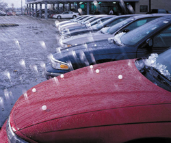 Hail storm damages a car, lots of minor dents!