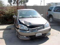 A Albuquerque auto collision resulted in front-end auto damage.